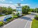 Grand Palm community entrance featuring a decorative tower and landscaped signage at 12472 Davie Ct, Venice, FL 34293
