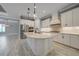 Spacious kitchen features a large center island, stainless steel appliances, and ample counter space at 12472 Davie Ct, Venice, FL 34293