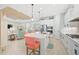 Open concept kitchen includes a large island, stainless appliances, and seamless flow to the living area at 12472 Davie Ct, Venice, FL 34293