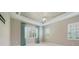Spacious main bedroom with tray ceiling, window shutters, and neutral color palette at 12472 Davie Ct, Venice, FL 34293
