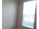 Bright bedroom with neutral walls and blinds offering natural light and privacy at 12656 Sagewood Dr, Venice, FL 34293