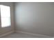 Bright bedroom with neutral walls, carpeting, and a window offering natural light at 12656 Sagewood Dr, Venice, FL 34293