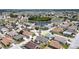 An aerial view shows the home and its surrounding neighborhood with a lake view at 1677 Palace Ct, Punta Gorda, FL 33980