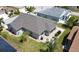 Aerial view of home featuring a spacious backyard, patio, and beautifully landscaped yard at 1677 Palace Ct, Punta Gorda, FL 33980