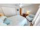 This bedroom has a ceiling fan, closet, and an chair next to a wood desk at 1677 Palace Ct, Punta Gorda, FL 33980