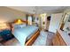 Comfortable bedroom with hardwood floors, a ceiling fan, and a serene ambiance at 1677 Palace Ct, Punta Gorda, FL 33980