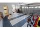 Spacious two-car garage with epoxy flooring, ample storage, and a side work area at 1677 Palace Ct, Punta Gorda, FL 33980