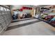 This garage has epoxy flooring, storage shelves, and lots of room for parking and storage at 1677 Palace Ct, Punta Gorda, FL 33980