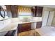 Modern kitchen with stainless steel appliances, granite countertops, and custom cabinetry at 1677 Palace Ct, Punta Gorda, FL 33980