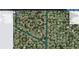 Aerial view of community with canal system and lush landscaping, showing proximity to wetlands and natural resources at 18459 Inwood Ave, Port Charlotte, FL 33948