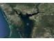 Aerial view highlighting location in relation to Charlotte Harbor, coastlines, and nearby towns at 18459 Inwood Ave, Port Charlotte, FL 33948
