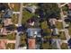 Aerial view of a property featuring a private pool in a tranquil, residential neighborhood at 18459 Inwood Ave, Port Charlotte, FL 33948