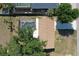 Aerial view of a cozy home with a screened-in pool and a well-maintained yard at 18459 Inwood Ave, Port Charlotte, FL 33948