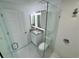 Bright bathroom showcasing white cabinets, granite counters, and a glass shower at 18459 Inwood Ave, Port Charlotte, FL 33948