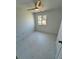 Bright bedroom with marble floors, a window, and white trim at 18459 Inwood Ave, Port Charlotte, FL 33948