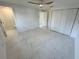 Bright bedroom with tile floors, ample closet space, and a view of the attached bathroom at 18459 Inwood Ave, Port Charlotte, FL 33948