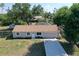 Charming single-story home with a well-manicured lawn and attached one car garage at 18459 Inwood Ave, Port Charlotte, FL 33948