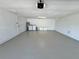 Clean, spacious garage with painted floor, laundry, and lots of storage at 18459 Inwood Ave, Port Charlotte, FL 33948