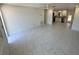 Bright living room with tile flooring, recessed lighting, and an open view to the kitchen at 18459 Inwood Ave, Port Charlotte, FL 33948