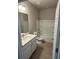 Well-lit bathroom featuring a shower-tub combination and vanity sink at 198 Arch Dr, Rotonda West, FL 33947
