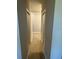 Hallway leading to rooms with modern flooring and neutral paint at 198 Arch Dr, Rotonda West, FL 33947