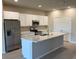 Modern kitchen with stainless steel appliances, granite counters and a large island at 198 Arch Dr, Rotonda West, FL 33947