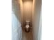 Small toilet room with standard toilet and door ajar at 198 Arch Dr, Rotonda West, FL 33947