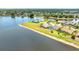 Gorgeous lakefront home featuring a pool and private backyard with manicured landscaping at 2202 Peterborough Rd, Punta Gorda, FL 33983