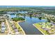 Picturesque community featuring gorgeous lakes, lush greenery, and desirable waterfront homes at 2202 Peterborough Rd, Punta Gorda, FL 33983