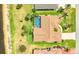 Aerial view of a well-maintained home with a pool, palm trees and lake access at 2202 Peterborough Rd, Punta Gorda, FL 33983