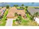 Beautiful waterfront home with a well-maintained lawn and garden, showcasing the property's curb appeal at 2202 Peterborough Rd, Punta Gorda, FL 33983
