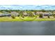 Spacious backyard with waterfront views and lush green grass with access to the lake at 2202 Peterborough Rd, Punta Gorda, FL 33983