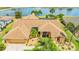 Stunning waterfront home boasts a charming exterior with well-manicured landscaping and a spacious two-car garage at 2202 Peterborough Rd, Punta Gorda, FL 33983