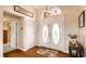 A welcoming foyer with decorative double doors, hardwood floors, and ample natural light at 2202 Peterborough Rd, Punta Gorda, FL 33983