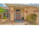 Home entrance with double doors and elegant lighting fixtures at 2202 Peterborough Rd, Punta Gorda, FL 33983