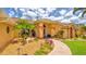 Inviting home entrance with colorful plants, stone bench, and walkway at 2202 Peterborough Rd, Punta Gorda, FL 33983