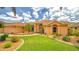 Beautiful single-story home with a well-manicured lawn and lush landscaping, offering great curb appeal at 2202 Peterborough Rd, Punta Gorda, FL 33983