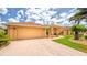 Charming single-story home with a two-car garage, mature landscaping, and a welcoming front entrance at 2202 Peterborough Rd, Punta Gorda, FL 33983