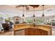 Open kitchen featuring granite countertops, stainless steel appliances, and a seamless view into the living area and pool at 2202 Peterborough Rd, Punta Gorda, FL 33983