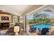Living room with direct access to the screened in lanai and pool area at 2202 Peterborough Rd, Punta Gorda, FL 33983