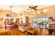 Inviting living room with ceiling fan and sliding glass doors to the lanai at 2202 Peterborough Rd, Punta Gorda, FL 33983