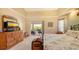 Bright bedroom with access to the lanai and views of the pool area at 2202 Peterborough Rd, Punta Gorda, FL 33983