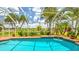 Enclosed pool offering a tranquil retreat with views of the lush landscaping and serene lake at 2202 Peterborough Rd, Punta Gorda, FL 33983