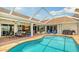 Sparkling pool surrounded by patio space, ideal for relaxation and outdoor gatherings at 2202 Peterborough Rd, Punta Gorda, FL 33983