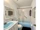 Functional bathroom featuring a bathtub-shower combination, a toilet, and a vanity area at 2314 Lee Ter, Port Charlotte, FL 33952