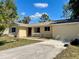 Single-story home featuring a front yard and a concrete driveway leading up to the house at 2314 Lee Ter, Port Charlotte, FL 33952