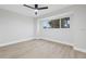 Minimalist bedroom with large window, providing ample natural light and serene views at 2531 Pebble Creek Pl, Port Charlotte, FL 33948
