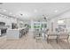 Bright and airy open-concept living room with modern decor and seamless flow to the outdoor pool area at 2531 Pebble Creek Pl, Port Charlotte, FL 33948
