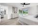 Bright main bedroom features a view of pool, closet, and seamless access to the en-suite bathroom at 2531 Pebble Creek Pl, Port Charlotte, FL 33948