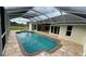 Inviting screened-in outdoor pool and patio area, perfect for relaxation and entertaining at 2531 Pebble Creek Pl, Port Charlotte, FL 33948